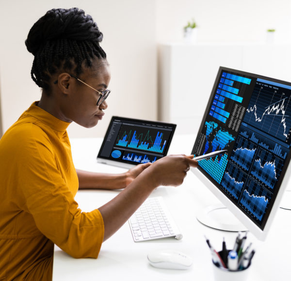 woman analyzing numbers on computer