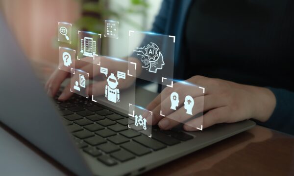 Person on a computer with Artificial Intelligence elements popping out